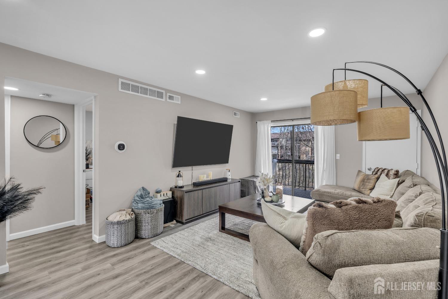 1933 Raspberry Court Edison, NJ 08817 - Photo 21 of 30 a living room with furniture and a flat screen tv