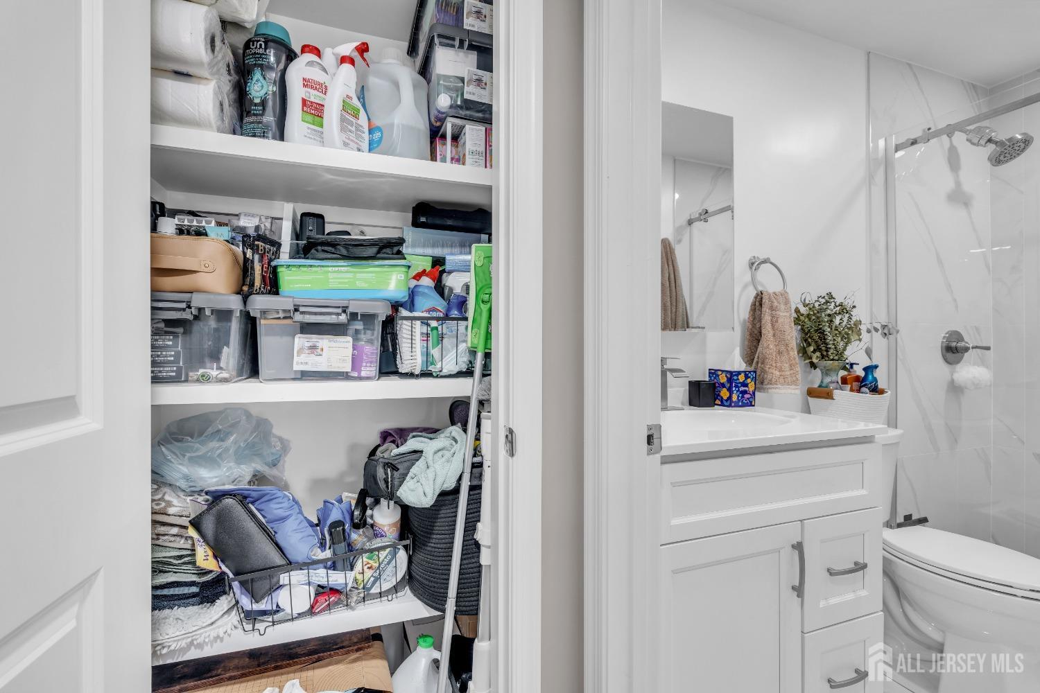 1933 Raspberry Court Edison, NJ 08817 - Photo 23 of 30 a bathroom with a refrigerator and a sink