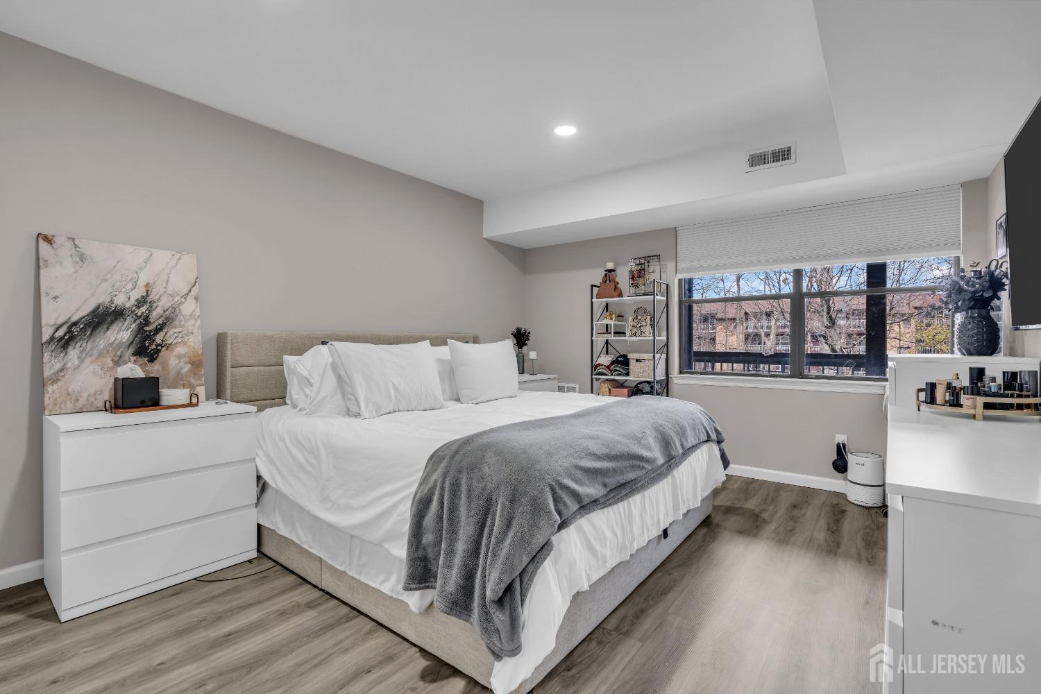 1933 Raspberry Court Edison, NJ 08817 - Photo 25 of 30 a bedroom with a large bed and a book shelf