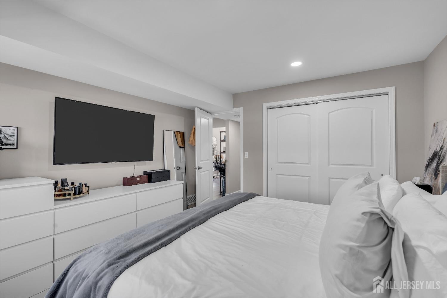 1933 Raspberry Court Edison, NJ 08817 - Photo 26 of 30 a bedroom with a bed and a flat screen tv