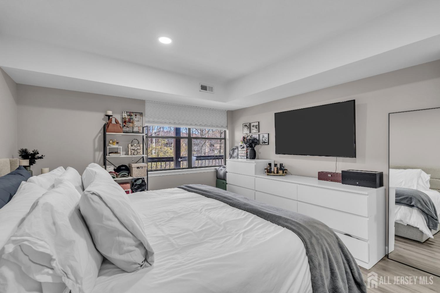 1933 Raspberry Court Edison, NJ 08817 - Photo 27 of 30 a bedroom with a bed and a flat screen tv