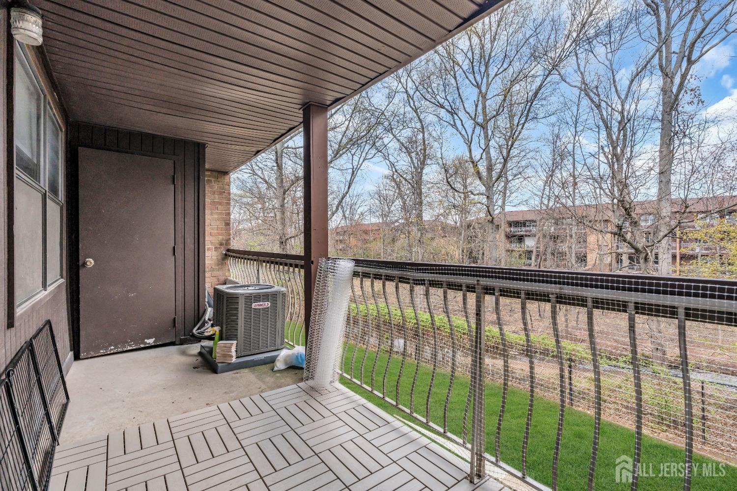 1933 Raspberry Court Edison, NJ 08817 - Photo 28 of 30 a view of a balcony with wooden floor and fence