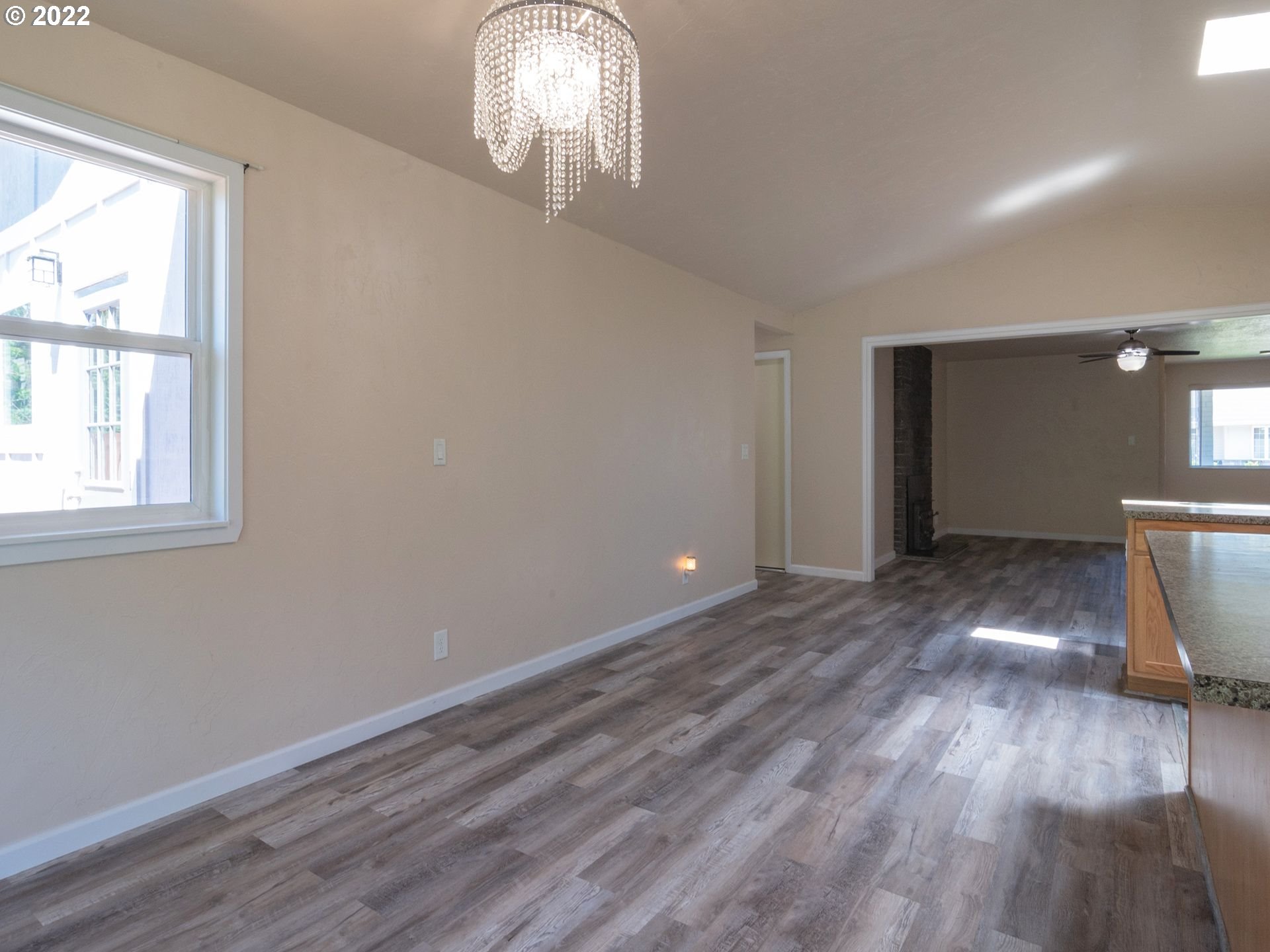 467 Mansfield Street Springfield, OR 97477 - Photo 11 of 32 a view of an empty room with wooden floor and a window