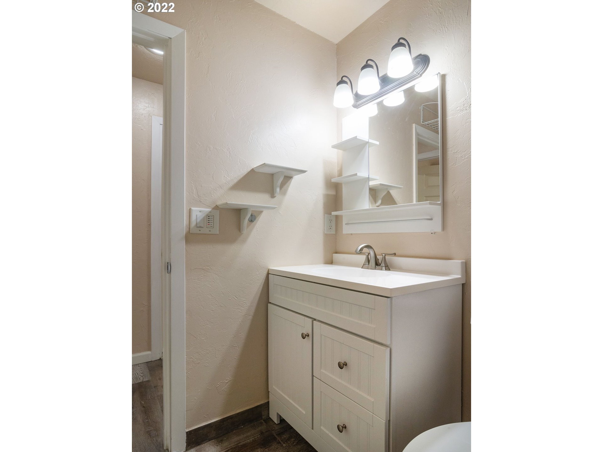 467 Mansfield Street Springfield, OR 97477 - Photo 16 of 32 a bathroom with a sink and a mirror