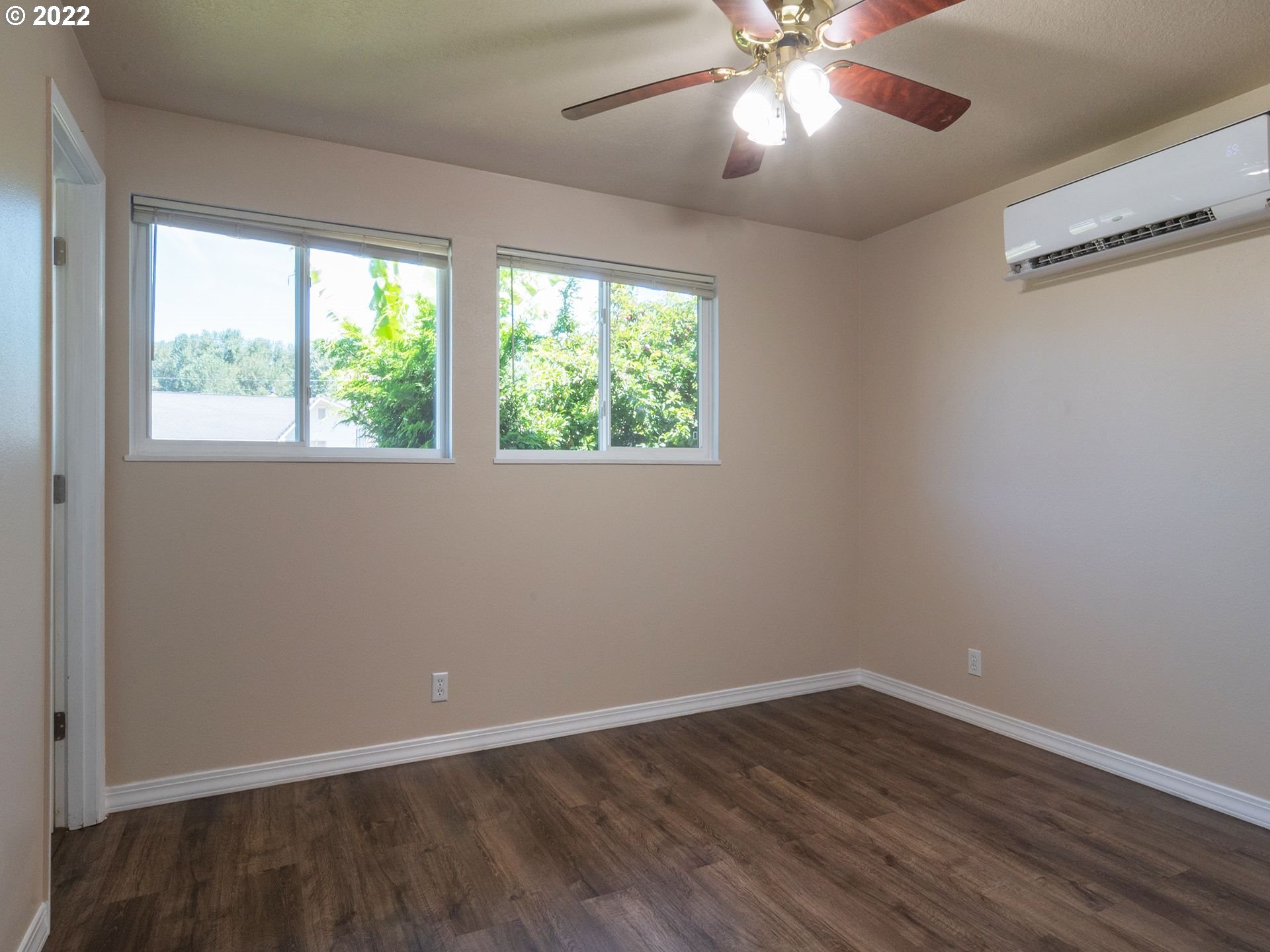 467 Mansfield Street Springfield, OR 97477 - Photo 17 of 32 a view of an empty room with wooden floor and a window
