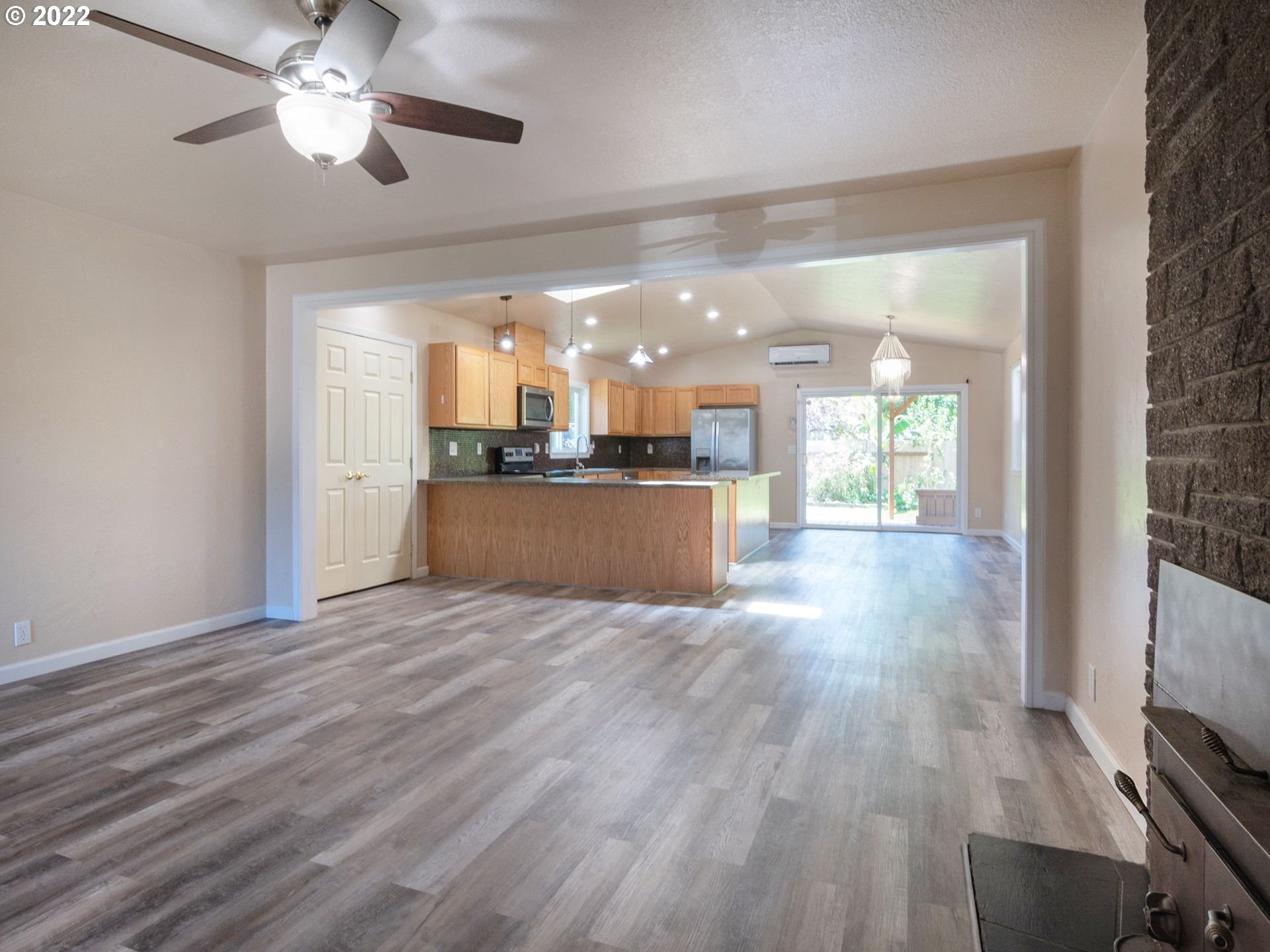 467 Mansfield Street Springfield, OR 97477 - Photo 5 of 32 a view of a kitchen with wooden floor and a kitchen