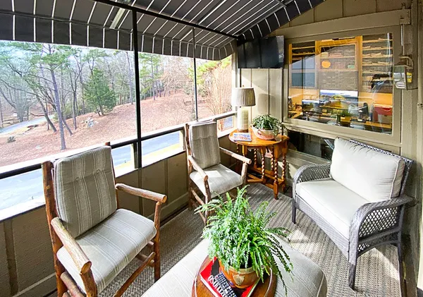 a living room with furniture and a rug