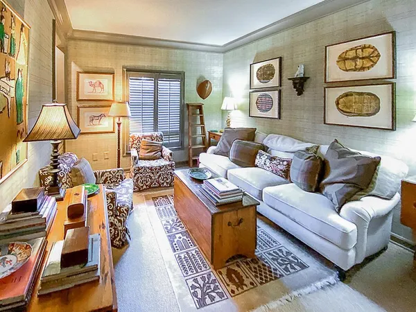 a living room with furniture and a rug