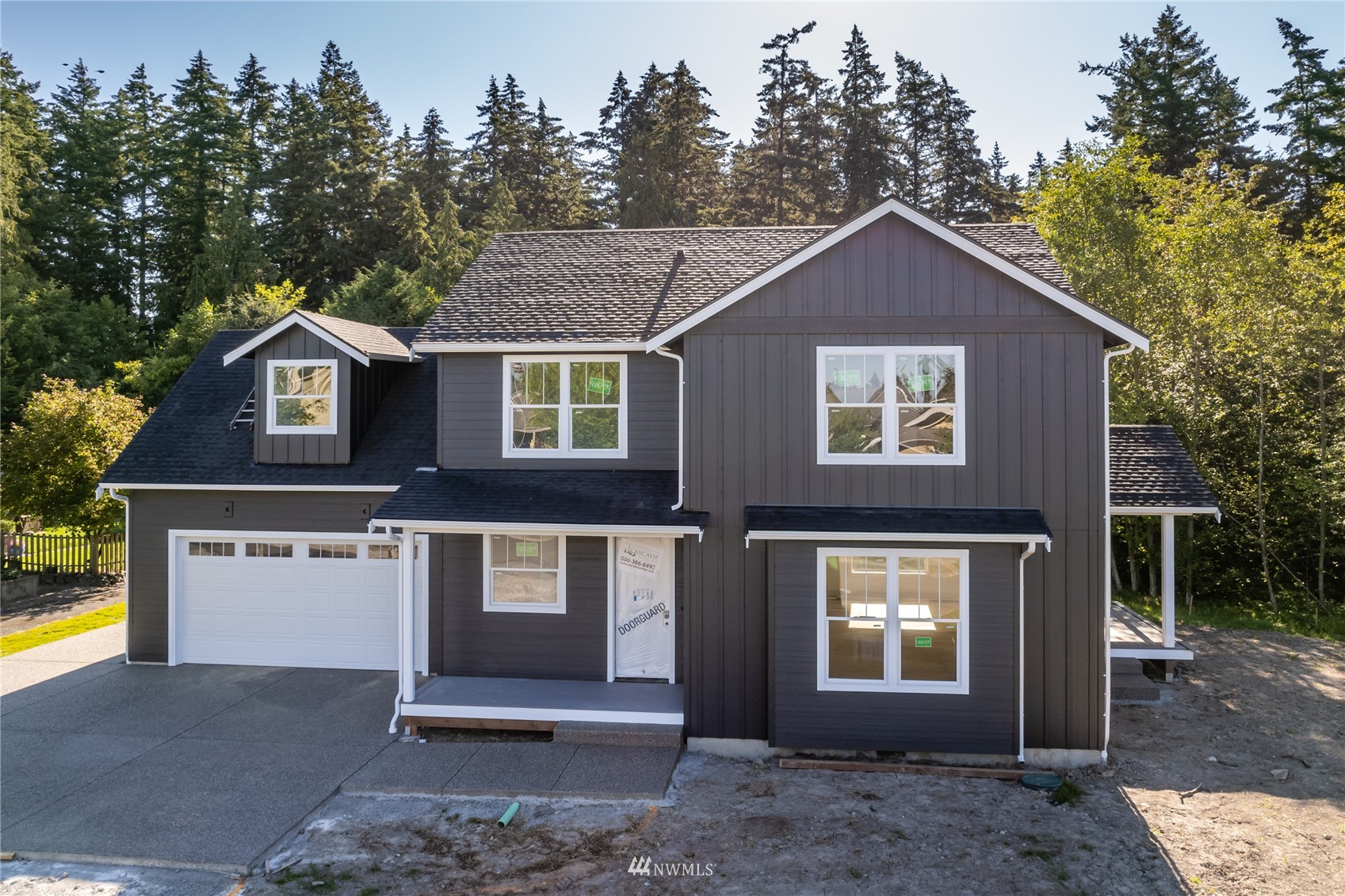 2284 South 19th Street Mount Vernon, WA 98274 - Photo 1 of 29 a front view of a house with a yard and garage