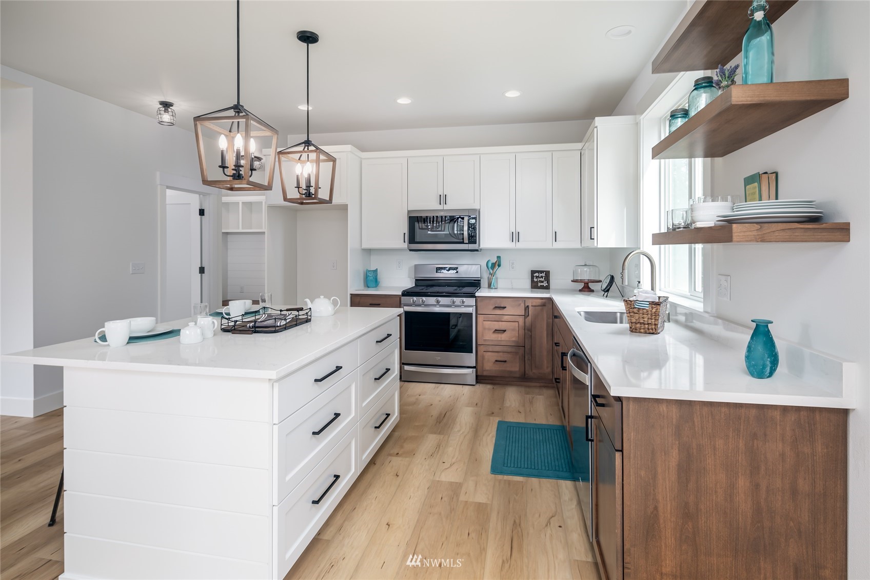 2284 South 19th Street Mount Vernon, WA 98274 - Photo 18 of 29 a kitchen with a stove a sink and cabinets