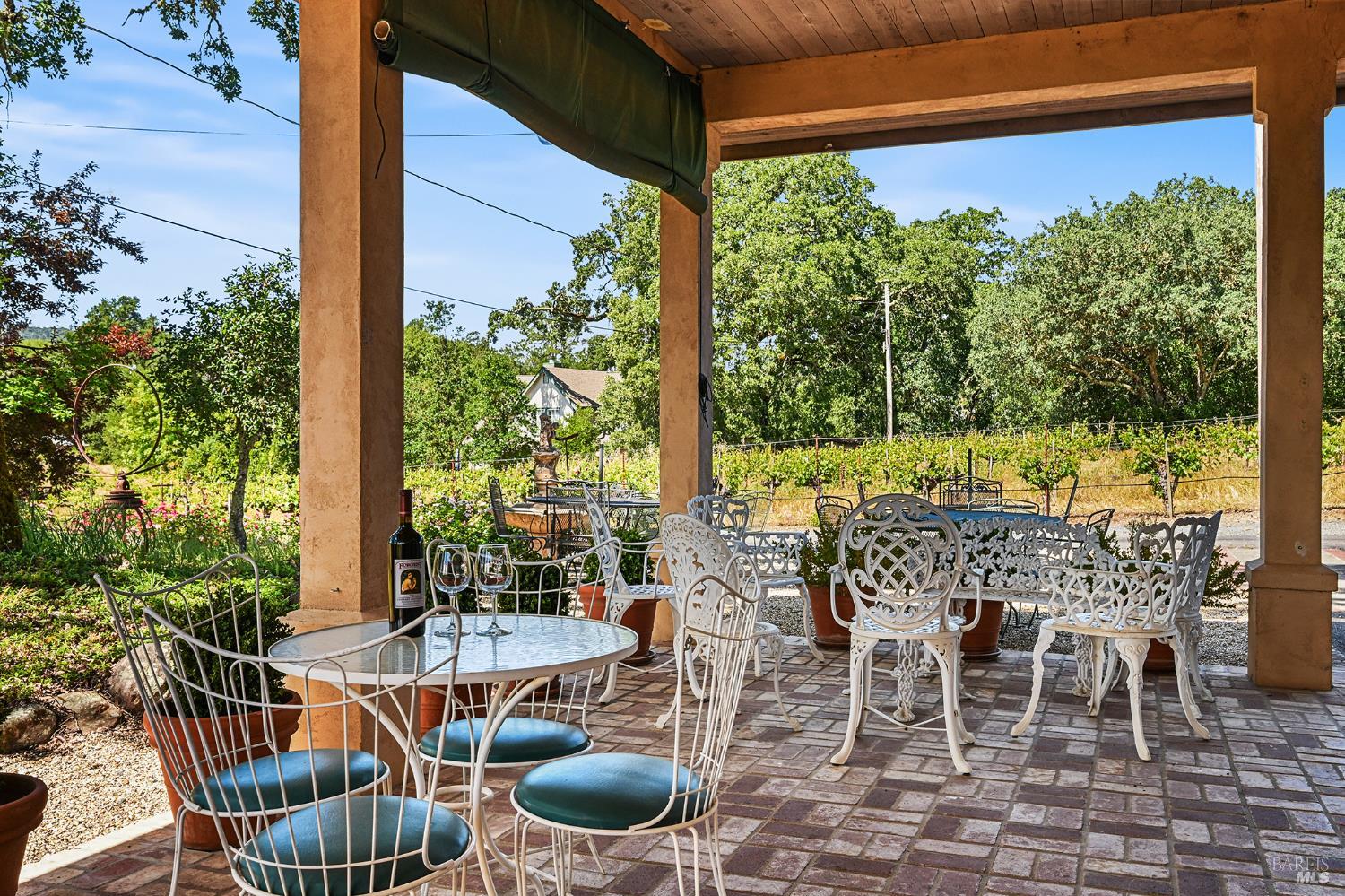 5143 Dry Creek Road Healdsburg, CA 95448 - Photo 18 of 85 a view of an outdoor dining space with furniture and garden view
