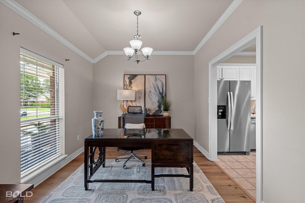 116 Augusta Avenue Benton, LA 71006 - Photo 5 of 38 a view of a workspace with furniture and a window