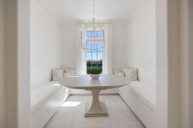 a bedroom with a bed and a night stand