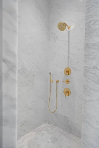 a bathroom with a bathtub and a shower