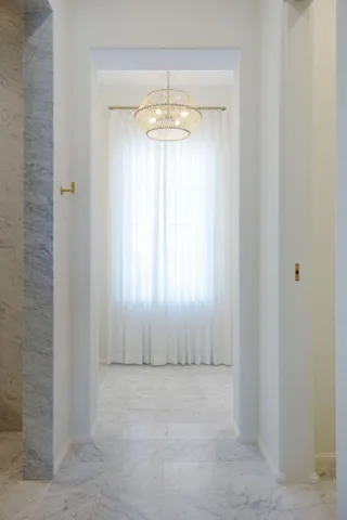 a bedroom with bed and a flat screen tv