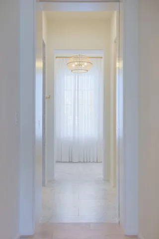 a bedroom with two beds and painting on the wall