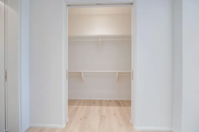 a bathroom with a sink vanity and a mirror