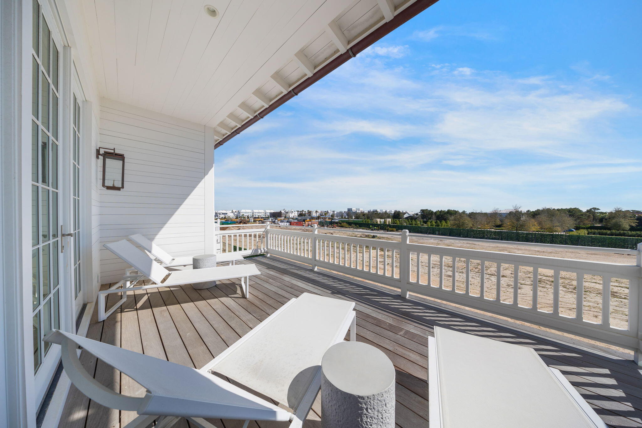 19 Astra Way Inlet Beach, Unit M12 Inlet Beach, FL 32461 - Photo 33 of 81 a view of a balcony with wooden floor and outdoor seating