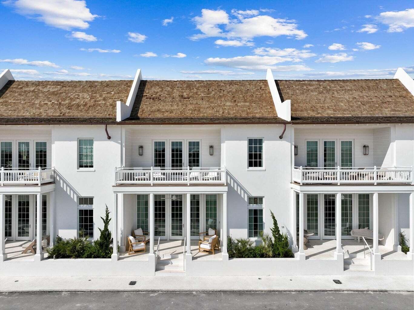 19 Astra Way Inlet Beach, Unit M12 Inlet Beach, FL 32461 - Photo 57 of 81 a view of a white building among the street with palm trees