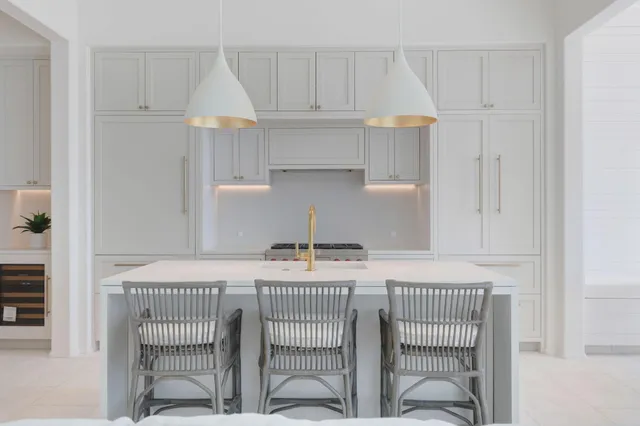 a room that has a bed and a table in it