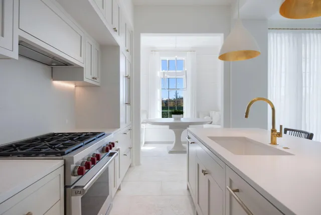 a dining room with furniture and a window