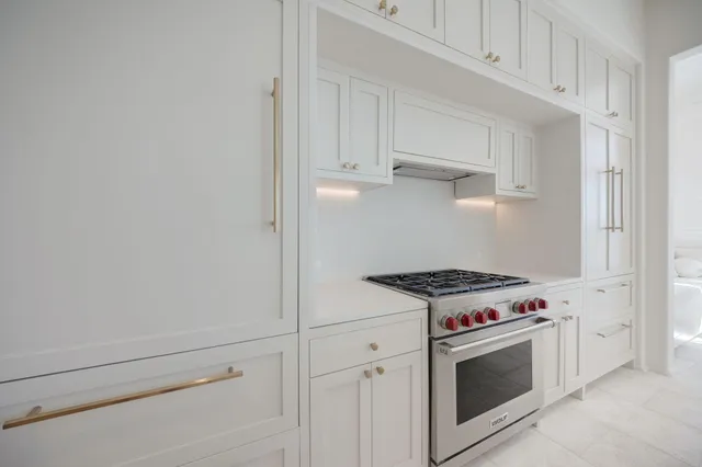 a living room with furniture potted plant and a large mirror
