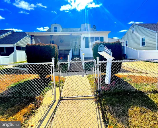 a view of a patio with table and chairs