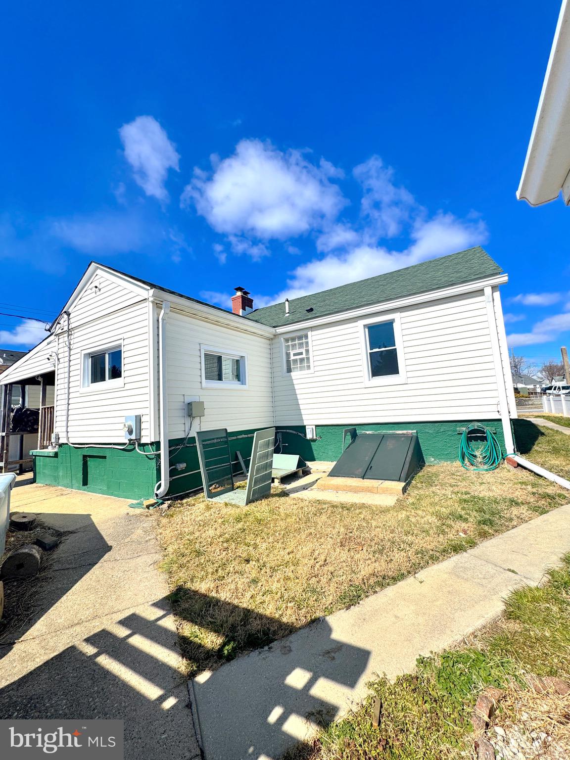 310 Pinewood Road Baltimore, MD 21222 - Photo 13 of 25 a view of a white house with a yard