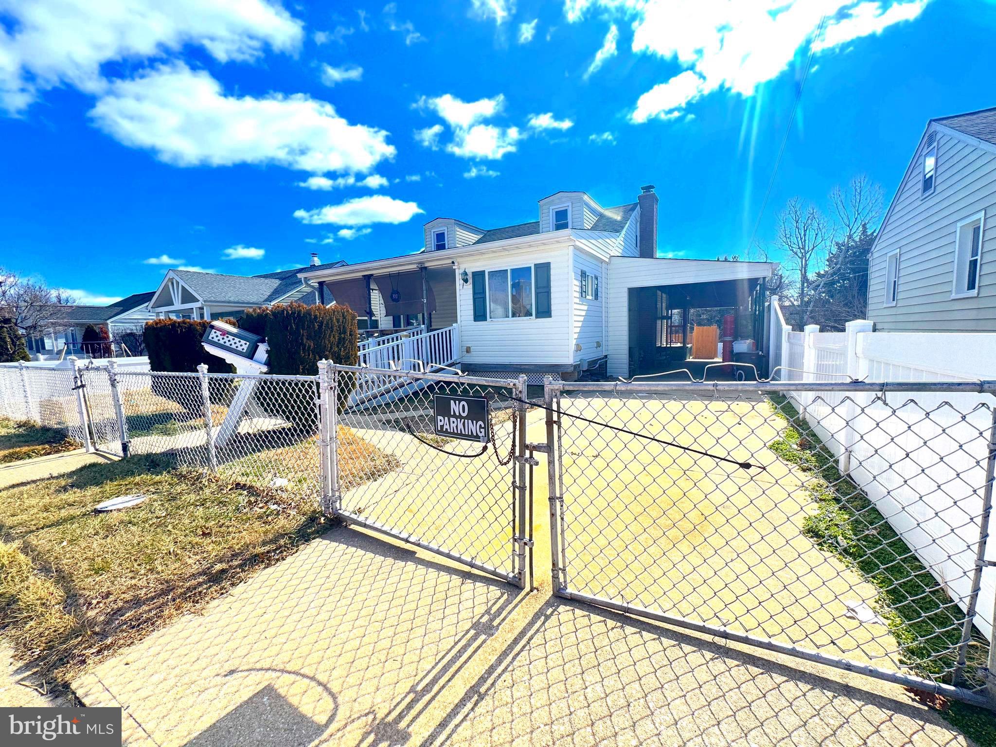 310 Pinewood Road Baltimore, MD 21222 - Photo 2 of 25 a view of a swimming pool with a patio