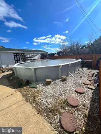 a view of patio with swimming pool