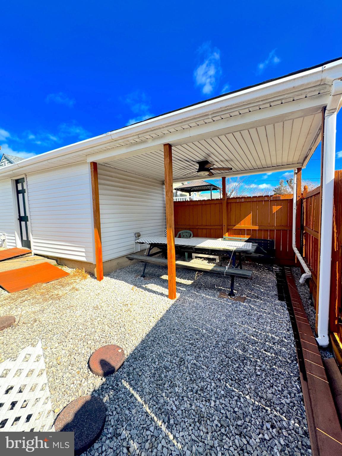 310 Pinewood Road Baltimore, MD 21222 - Photo 7 of 25 a backyard of a house with barbeque oven table and chairs