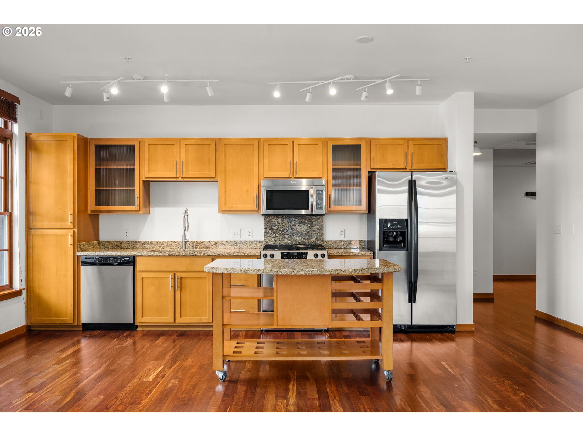 2350 Northwest Savier Street, Unit 224 Portland, OR 97210 - Photo 8 of 19 a kitchen with stainless steel appliances granite countertop a stove a sink and a refrigerator