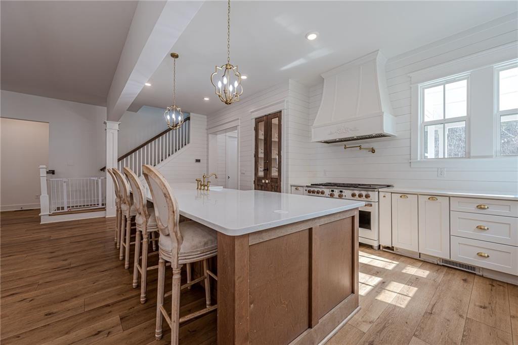 312 Ball Field Road Waleska, GA 30183 - Photo 13 of 73 an open kitchen with a table and chairs