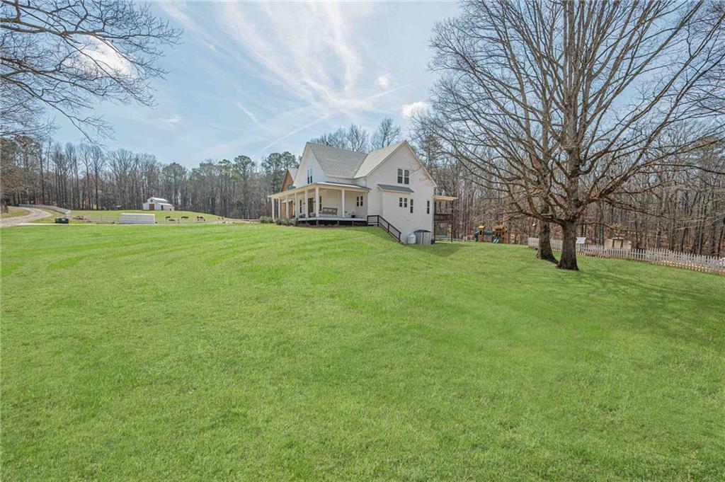 312 Ball Field Road Waleska, GA 30183 - Photo 2 of 73 a front view of house with yard and trees