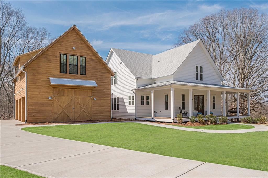 312 Ball Field Road Waleska, GA 30183 - Photo 3 of 73 a front view of house with yard and green space