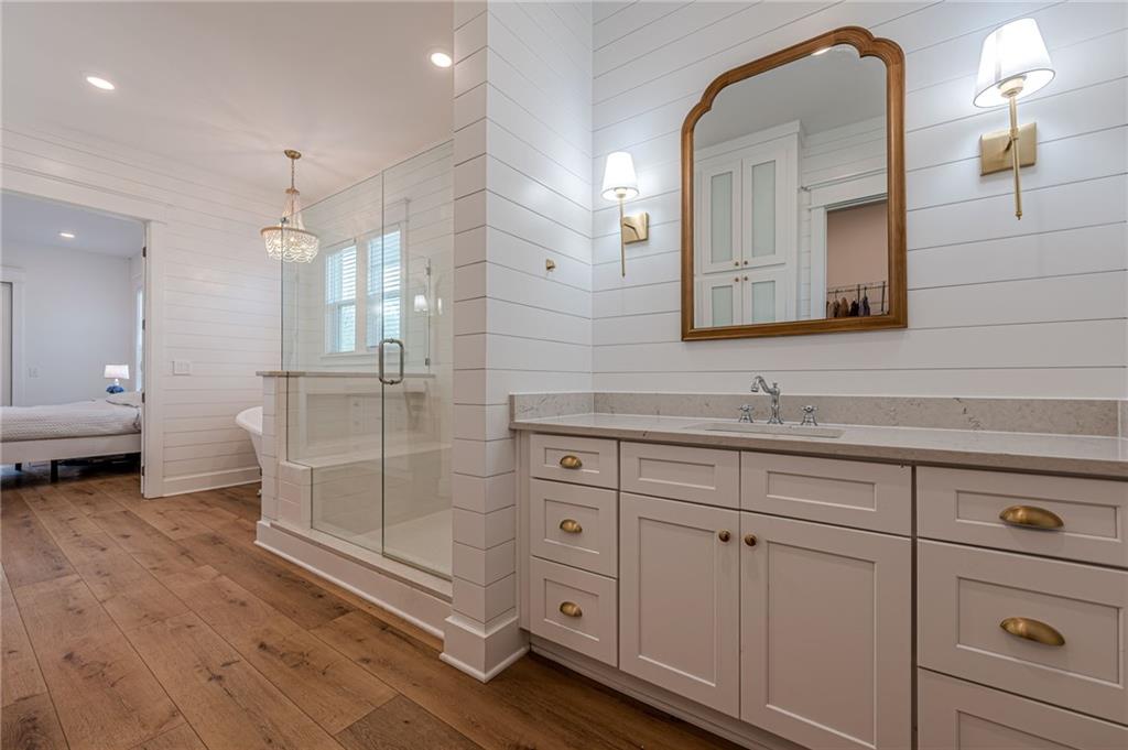 312 Ball Field Road Waleska, GA 30183 - Photo 31 of 73 a bathroom with a double vanity sink mirror and shower