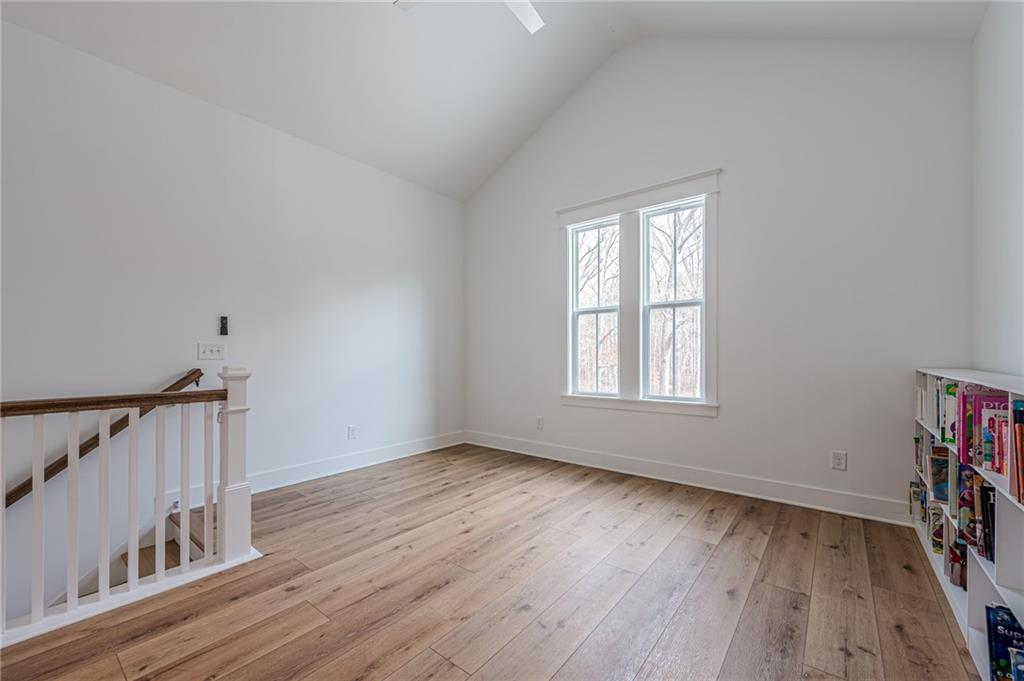 312 Ball Field Road Waleska, GA 30183 - Photo 33 of 73 a view of an empty room with wooden floor and a window