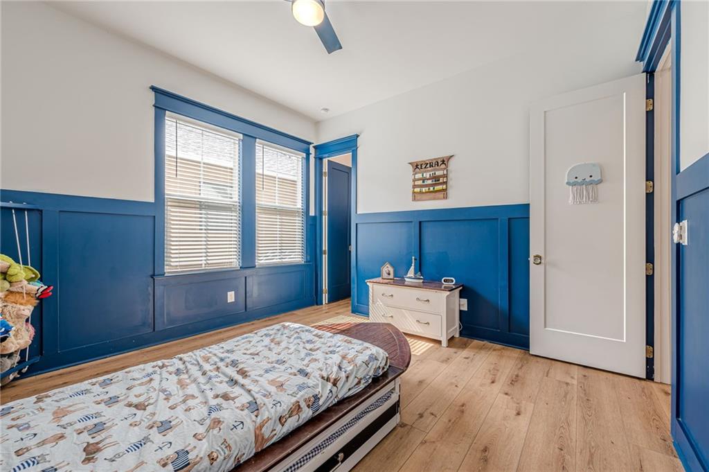 312 Ball Field Road Waleska, GA 30183 - Photo 35 of 73 a bedroom with a bed and wooden floor