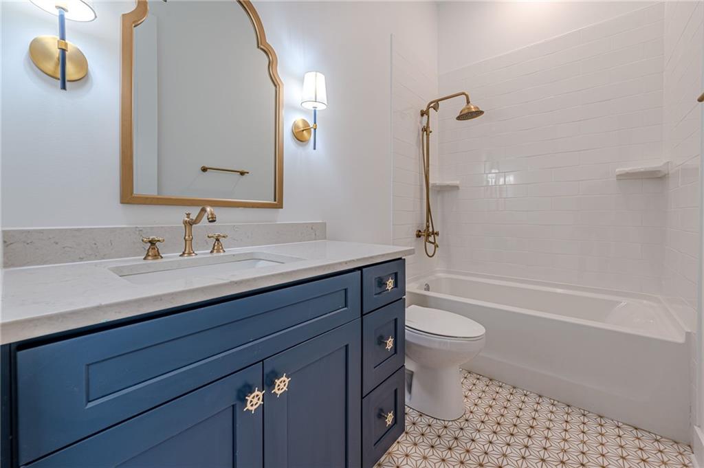 312 Ball Field Road Waleska, GA 30183 - Photo 37 of 73 a bathroom with a sink a toilet and shower