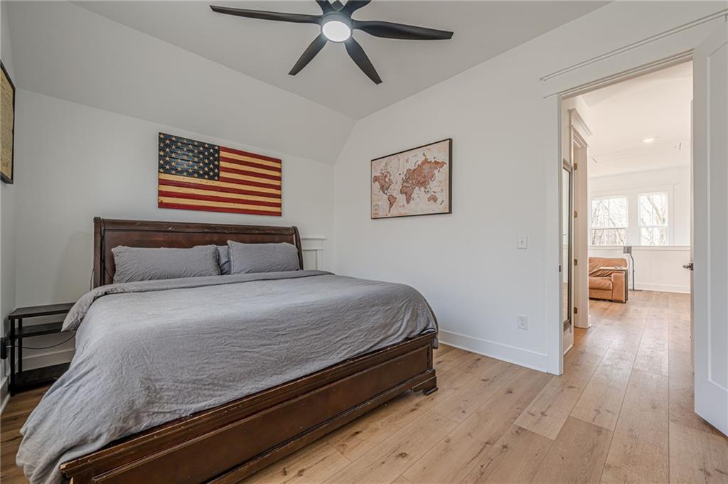 312 Ball Field Road Waleska, GA 30183 - Photo 57 of 73 a bedroom with a bed and a chandelier