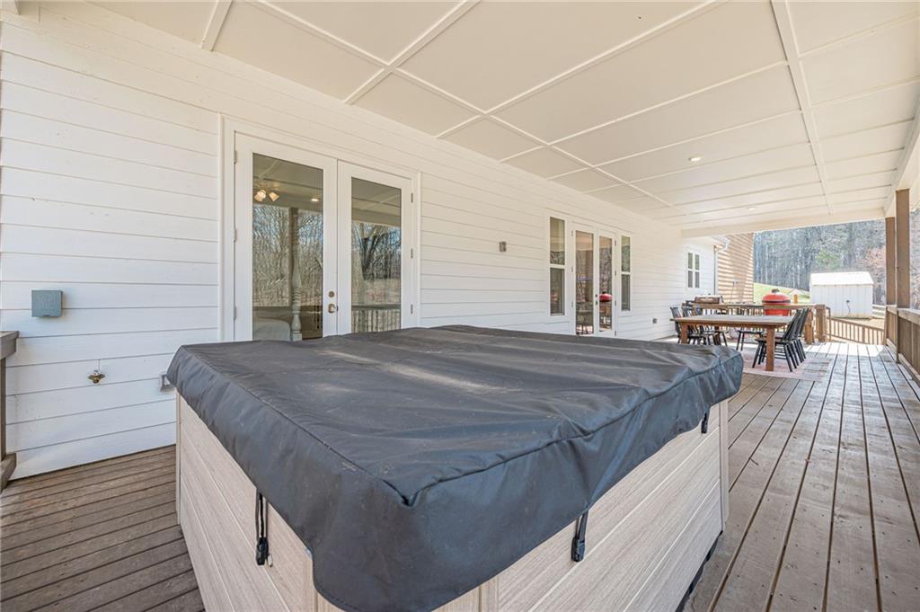 312 Ball Field Road Waleska, GA 30183 - Photo 59 of 73 a spacious bedroom with a bed and wooden floor