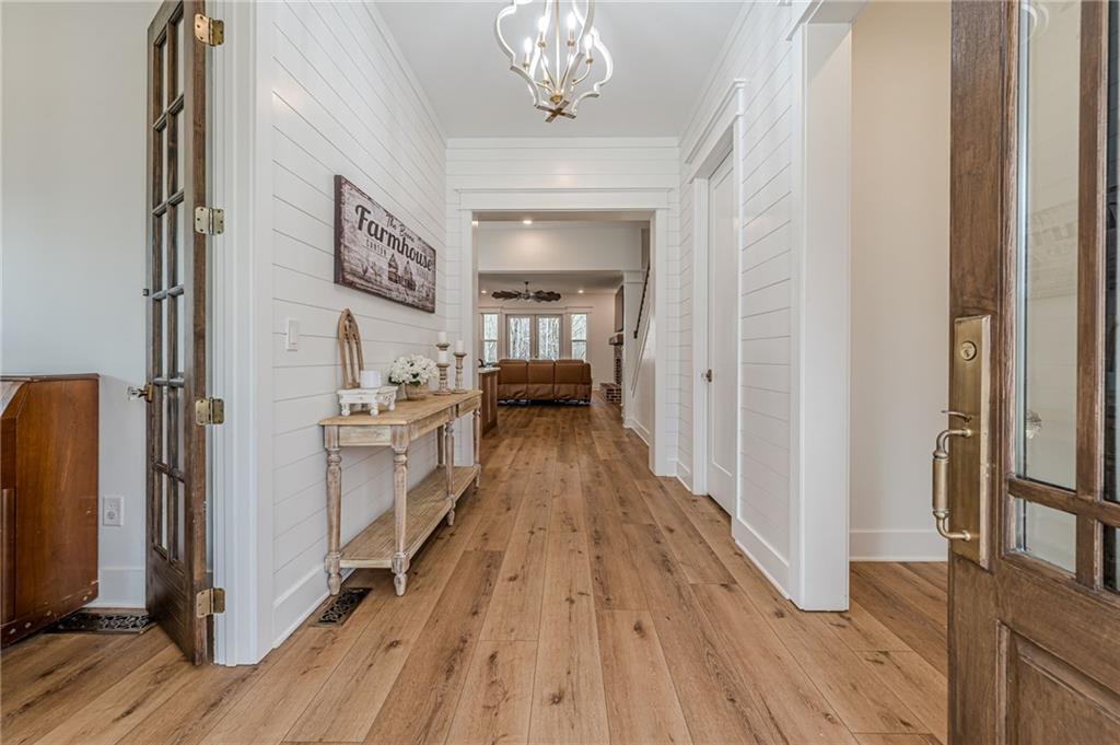 312 Ball Field Road Waleska, GA 30183 - Photo 8 of 73 a view of a hallway with wooden floor and staircase