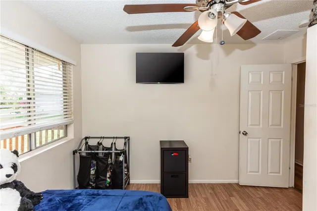 a view of a livingroom with furniture wooden floor and chandelier