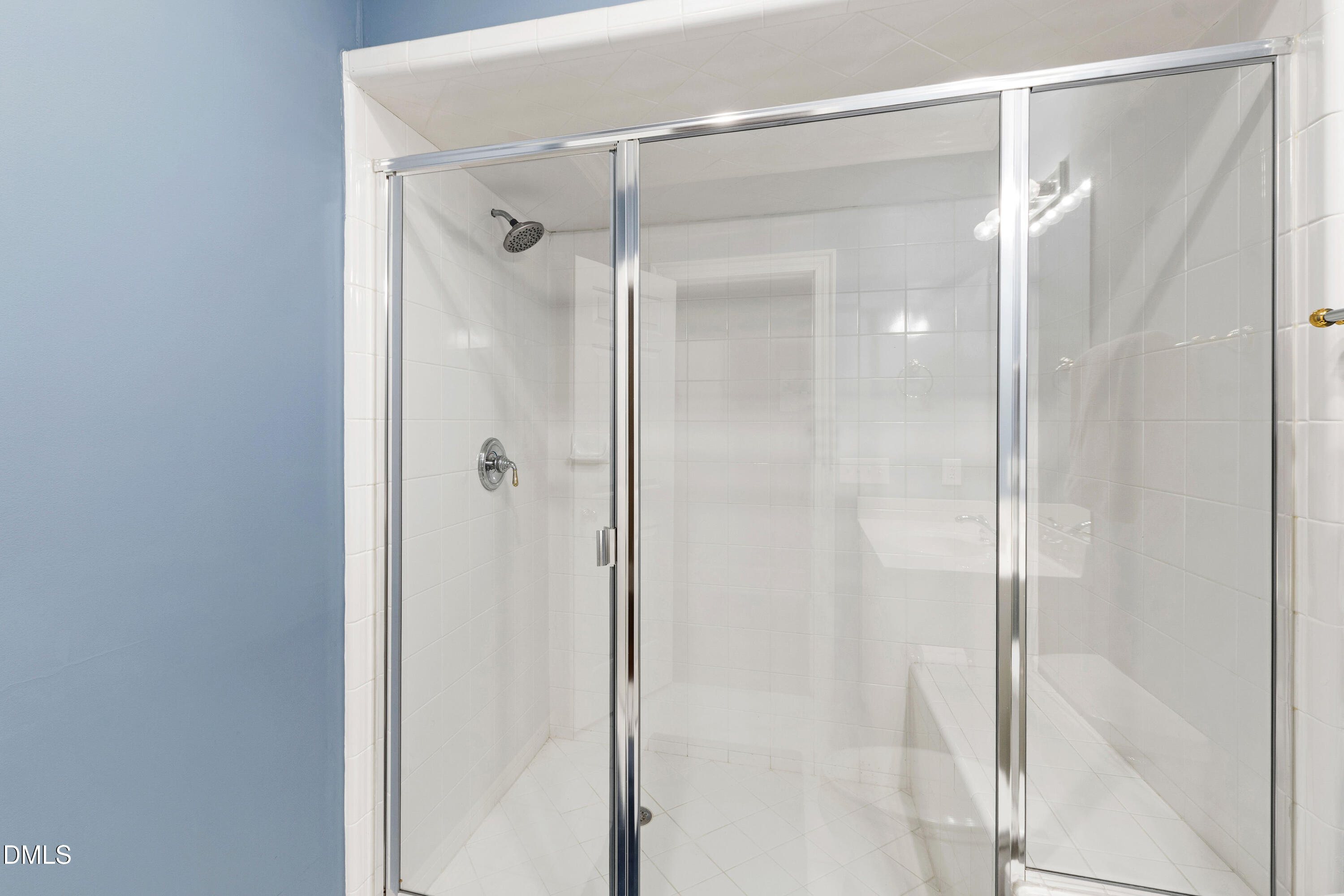 2536 Wake Drive Raleigh, NC 27608 - Photo 60 of 74 a bathroom with a glass shower door