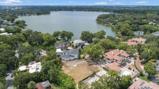 an aerial view of a city with lake view