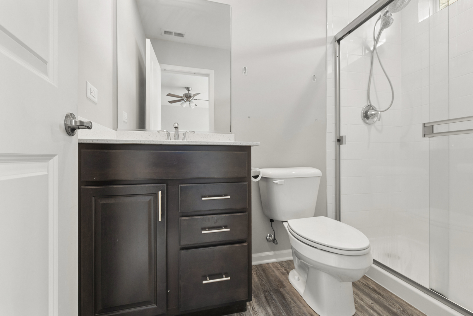 2045 Stuttle Road Batavia, IL 60510 - Photo 11 of 18 a bathroom with a toilet a sink and a mirror