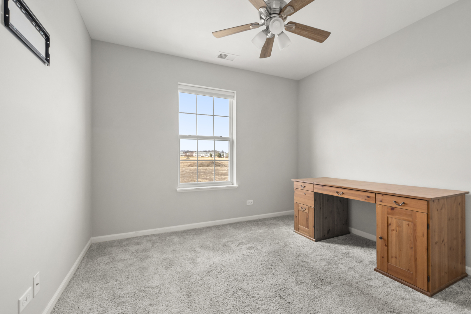 2045 Stuttle Road Batavia, IL 60510 - Photo 12 of 18 an empty room with windows and fan
