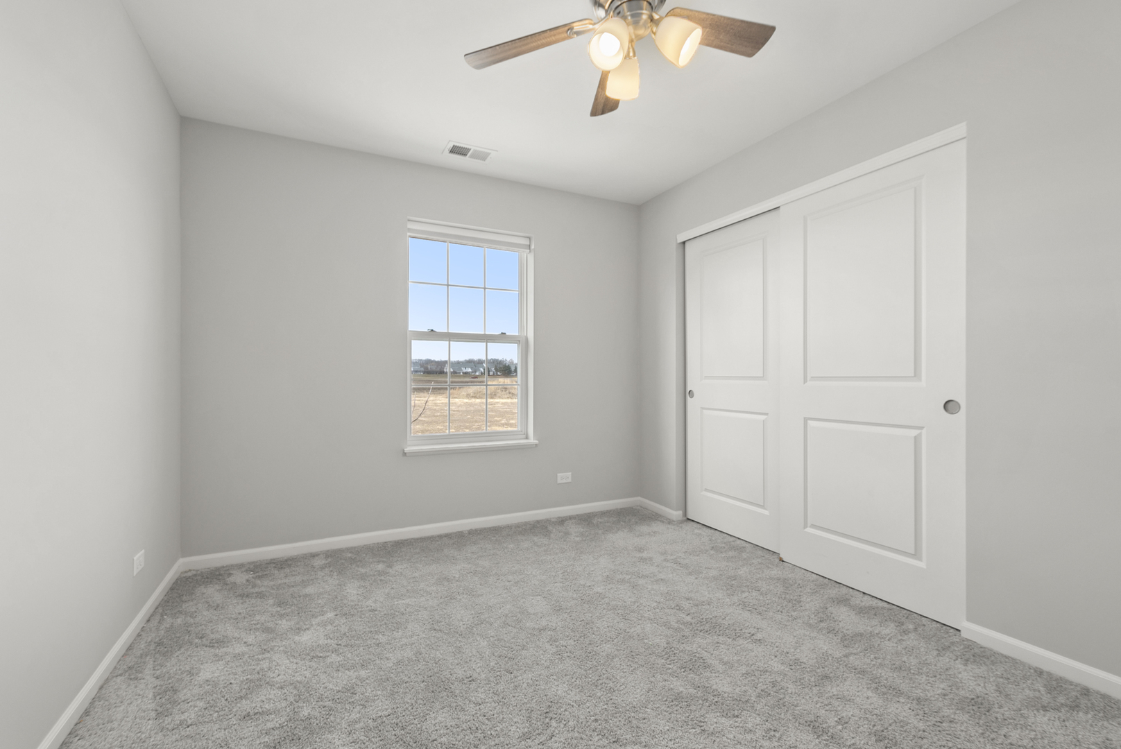 2045 Stuttle Road Batavia, IL 60510 - Photo 13 of 18 an empty room with a chandelier fan