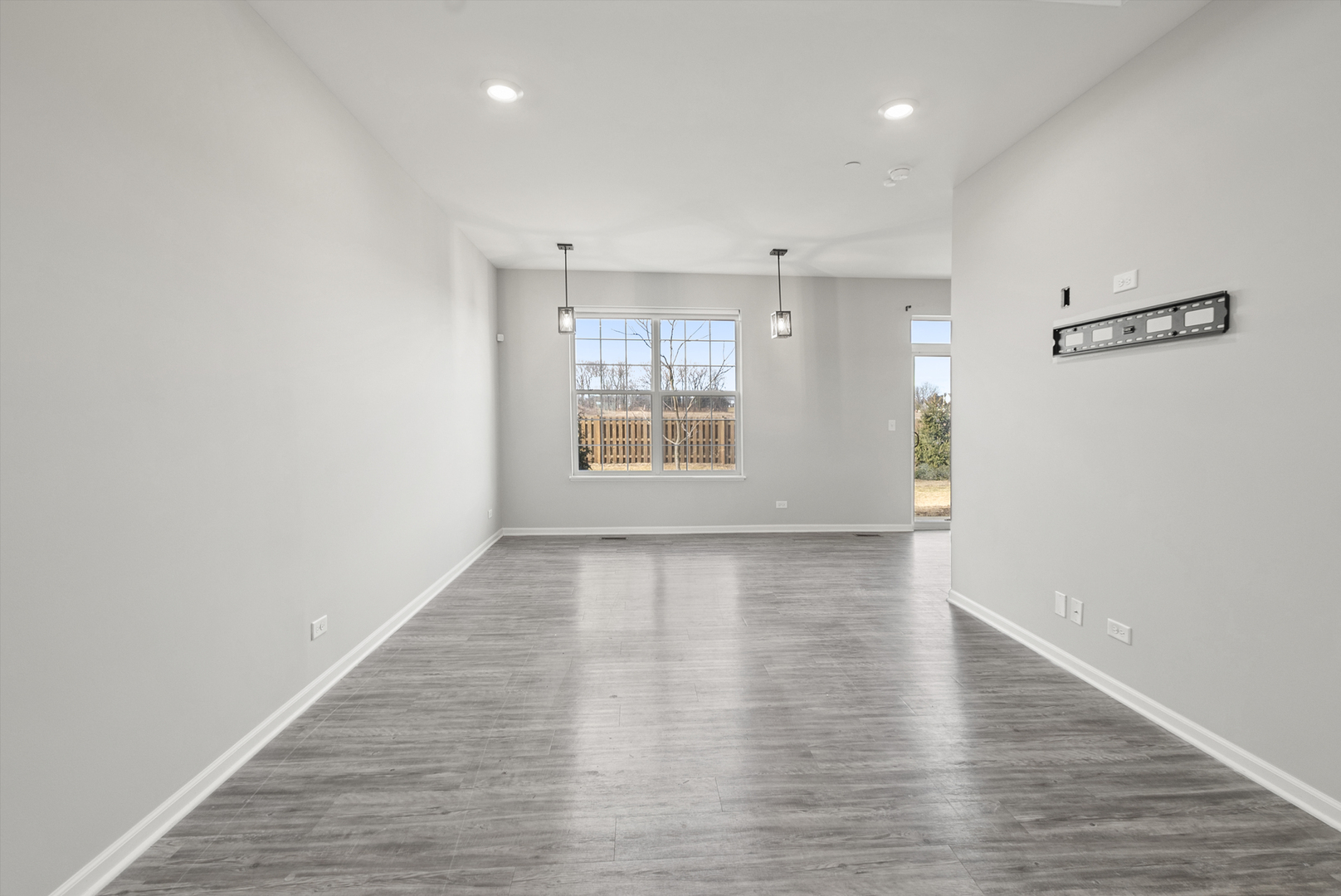2045 Stuttle Road Batavia, IL 60510 - Photo 2 of 18 an empty room with wooden floor and windows