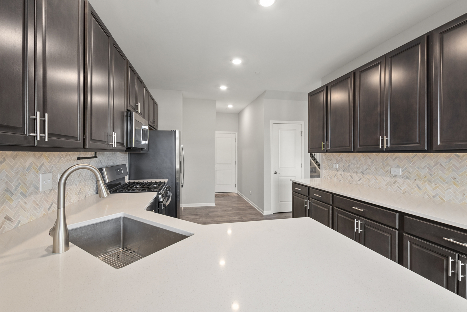 2045 Stuttle Road Batavia, IL 60510 - Photo 6 of 18 a kitchen with stainless steel appliances granite countertop a sink a stove and a refrigerator